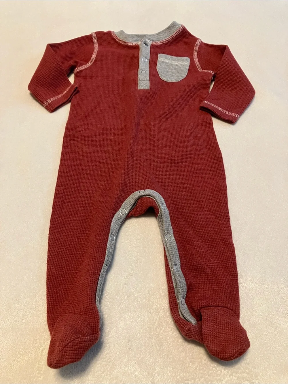 Cozy Red Waffle-Knit Baby One-Piece with Chest Pocket